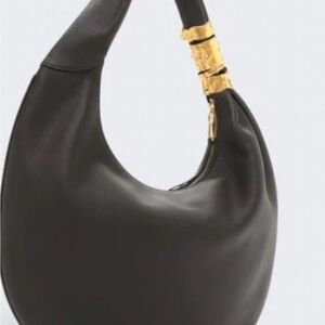 Elegant Black Hobo Bag with Gold Accents